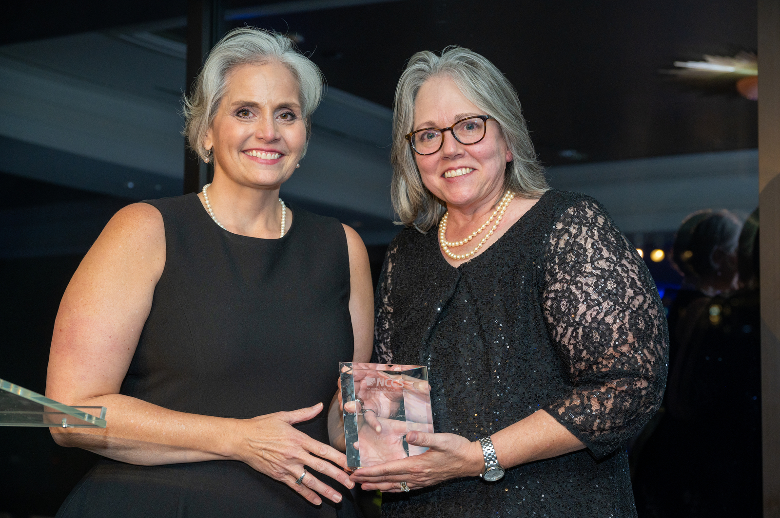 NCCS CEO Shelley Fuld Nasso (L) presents the 2022 Ellen L. Stovall Patient Advocate Award to Alicia Staley (R).