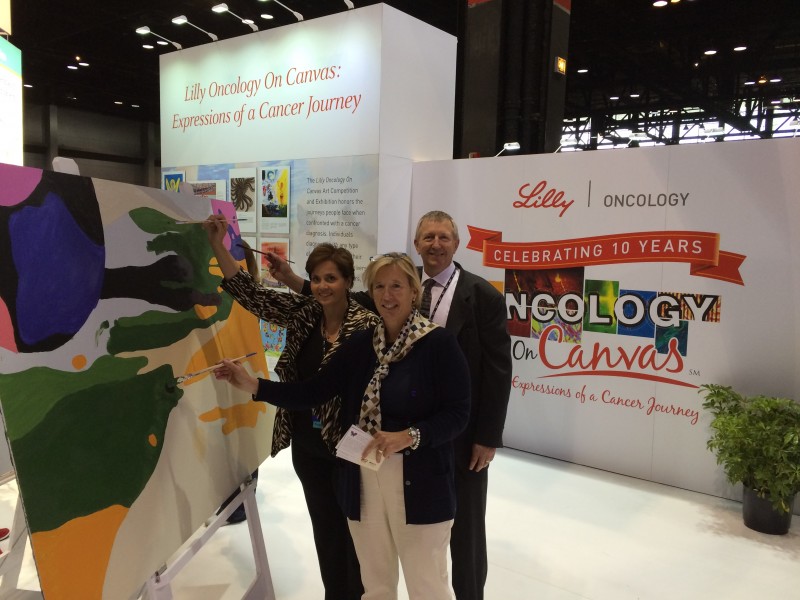 Tim Wert of Eli Lilly and Company with Shelley Fuld Nasso and Nina Wendling of NCCS at the Hope Murals Project Booth at ASCO