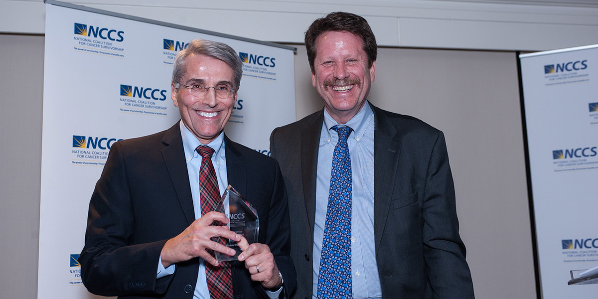 Pazdur posing with award, and Califf