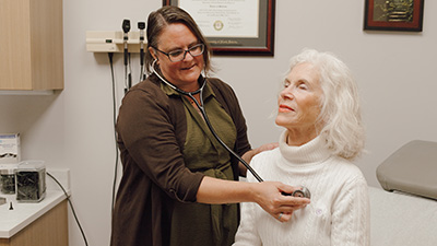 Debbie Wasserman checking on a patient