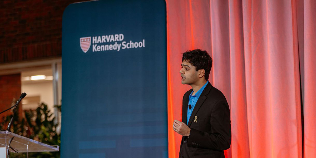 Eshan Vishwakarma speaking at Harvard University on stage