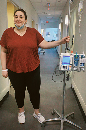 Joslyn Trovati next to medical equipment at a hospital