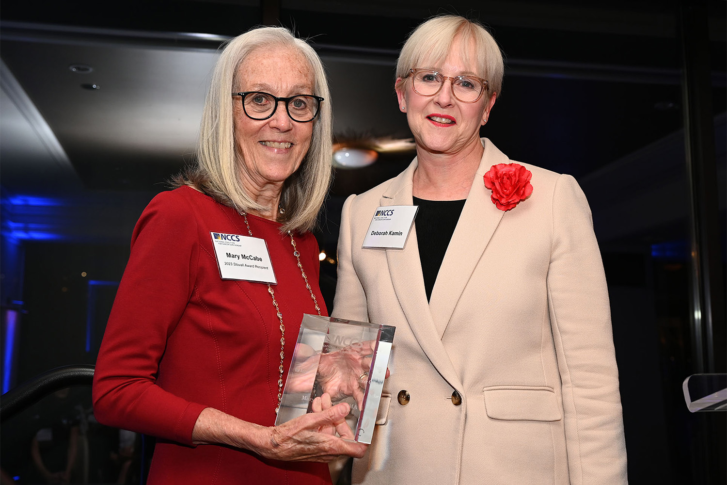 Photo of Mary McCabe receiving Stovall Award from presenter Deborah Kamin