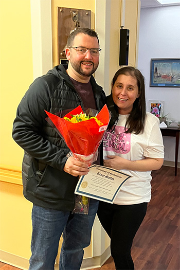 Tracy and Tim Steffek holding flowers