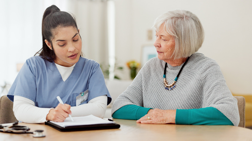 a photo of a medical professional and patient discussing a care plan