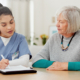 a photo of a medical professional and patient discussing a care plan