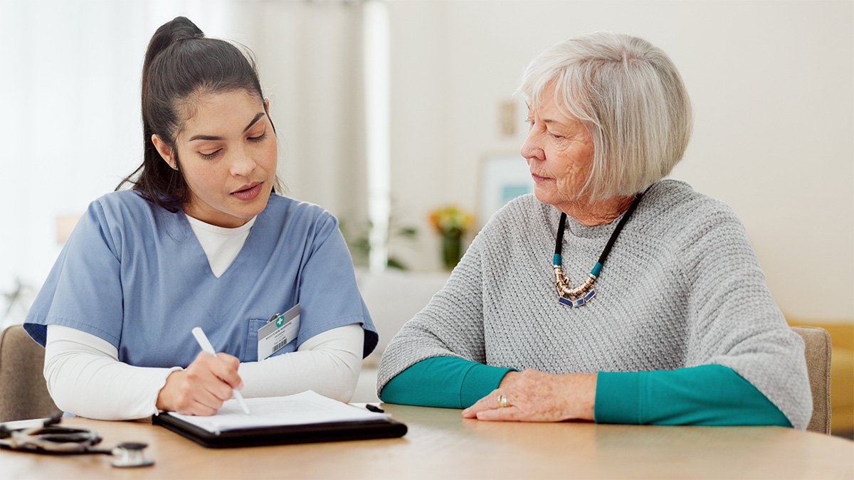 a photo of a medical professional and patient discussing a care plan