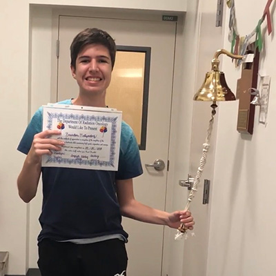 Brandon Hertzendorf "rings the bell" after finishing treatment