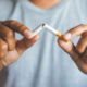 Man breaking cigarette
