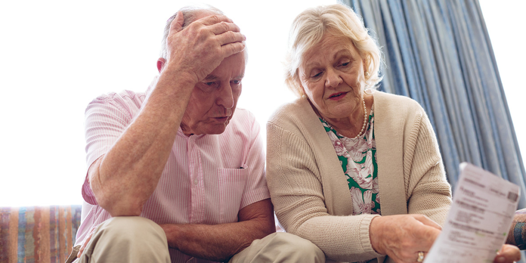 Seniors discussing medical bill