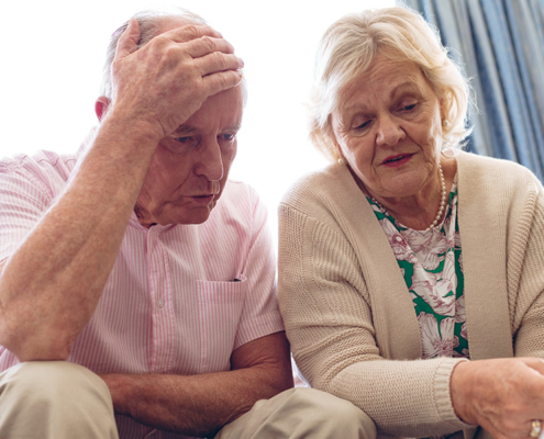Seniors discussing medical bill